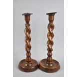 A Pair of Edwardian Oak Barley Twist Candlesticks, 30cms High