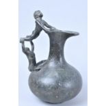 A Patinated Bronze Jug, Handle in the Form of Young Gymnasts, 19cms High