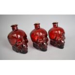 Three Red Glass Decanters/Bottles in the Form of Skulls