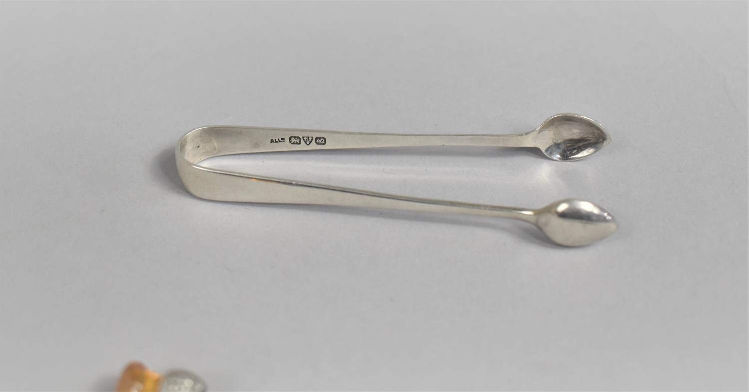 A Silver Sugar Bow and Silver Pickle Fork by Adie and Lovekin, Chester Hallmark for 1927 and 1892 - Image 2 of 2