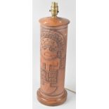 A Cylindrical Tooled Leather Covered Table Lamp Base with Aztec Decoration, 48cms High