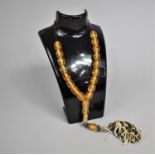 A Set of Amber and Silver Worry Beads