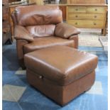 A Matching Leather Effect Armchair and Matching Stool