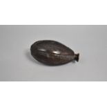 A Far Eastern Coquilla Nut Flask of Ovoid Form, 13cms High