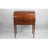 A Reproduction Cylinder Bureau with Pull Out Slide having Tooled Leather Writing Surface, Fitted