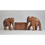 A Carved Far Eastern rectangular Box and Two Similar Souvenir Elephants, 23cms High