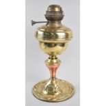 An Arts and Crafts Copper and Brass Oil Lamp Base, Relief Decoration to Circular Foot, 38cms High