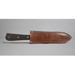 An Italian Whitby Throwing Knife in Leather Sheath, 23.5cms Long