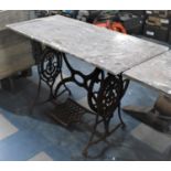 A Vintage Cast Iron Singer Sewing Machine Treadle Base with Marble Top, 107cms by 51x73cms High