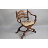 A Mid 20th Century Oak Framed and Tapestry Seated X Frame Armchair with Ladder Back and Scrolled