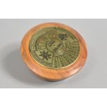 A Brass 40 Year Calendar, 2005-2044, Mounted on Turned Yew wood Stand, 8.25cms Diameter