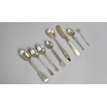 A Collection of Various Silver and white Metal Spoons and a Mother of Pearl Handled Butter Knife