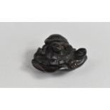 A Finely Carved Wooden Netsuke, Young Tortoise Riding Mother on Lily Pad, 3.5cms Long