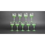A Set of 9 Vaseline Sherry Glasses with Faceted Cupped Bowls and Circular Feet