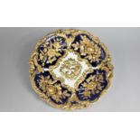 A Porcelain Meissen Style Dish Decorated in the Shallow Relief with Roses and Scrolls on Cobalt Blue