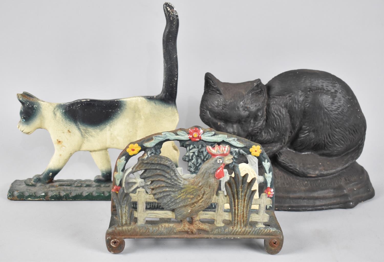 Two Modern Cast Iron Cold Painted Doorstops in the Form of Cats together with a Letter Rack in the