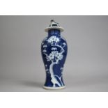 A Late 20th Century Chinese Porcelain Prunus Pattern Baluster Vase and Cover, 27cm