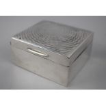 A Silver Mounted Cigarette Box with Engine Turned Lid, Birmingham Hallmark, 9.5cm wide x 5cm high