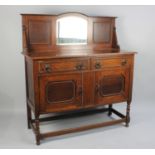 An Edwardian Oak Mirror Backed Sideboard with Two Drawers over Cupboard Base, 121cms Wide
