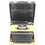 A Mid 20th Century Silver-Reed Silverette Portable Manual Typewriter in Yellow