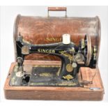 A Vintage Oak Cased Manual Singer Sewing Machine