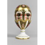 A Royal Crown Derby Imari Easter Egg and Egg Cup, Pattern 1128 with Gold Stopper