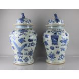 A Pair of Large Reproduction Chinese Blue and White Baluster Vase and Covers Having Temple Lion