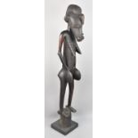 A Tall Carved Wooden African Souvenir Figural Study, 140cms High
