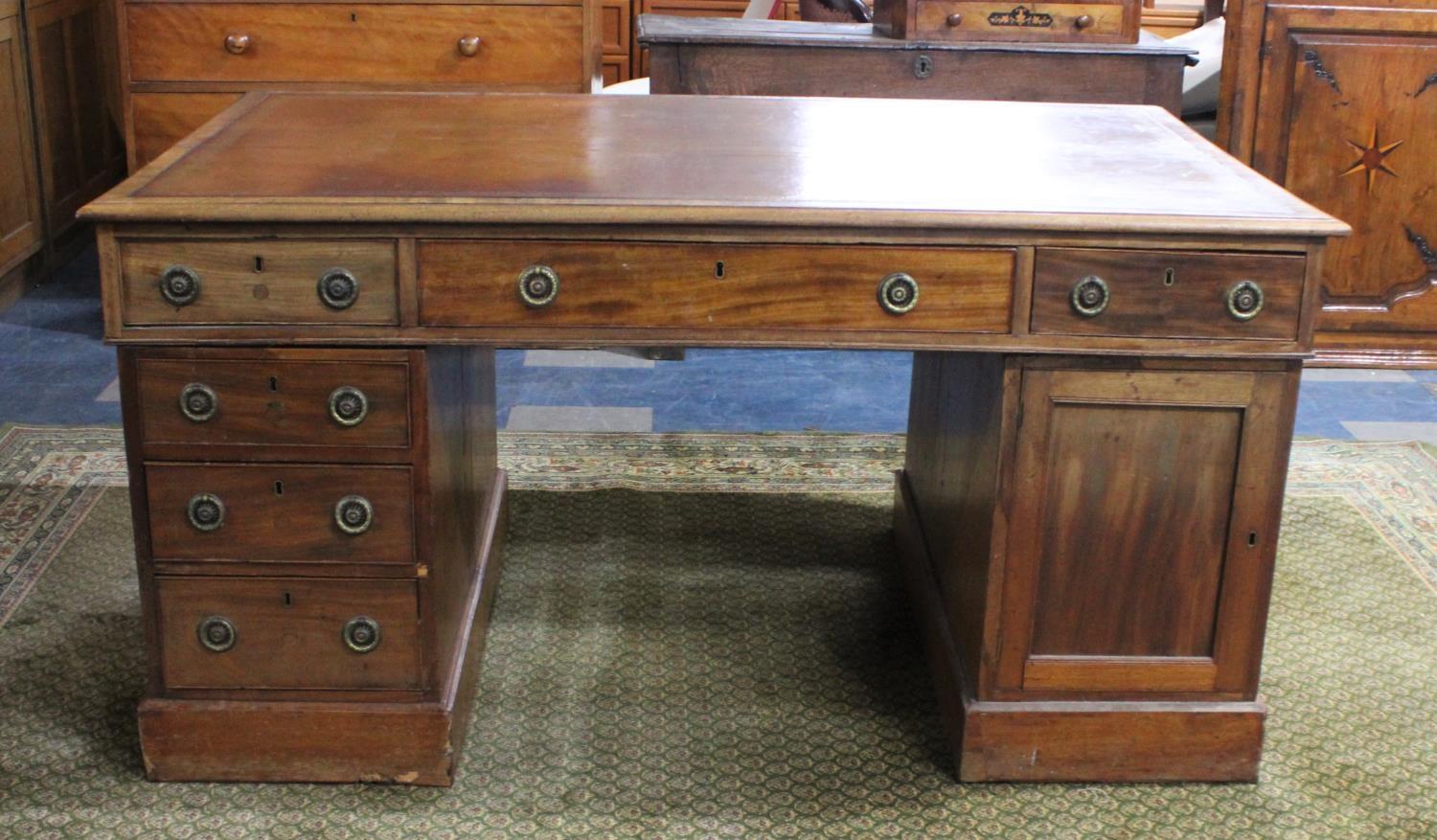 An Edwardian Partners Desk with Tooled Leather Top, Centre Long Drawer Flanked by Two Short