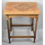 An Edwardian Oak Rectangular Occasional Table with Bobbin Supports, Inlaid Top, Some Water Damage,