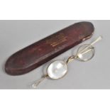 A Pair of early 20th Century Gold Plated Spectacles in Case