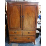 A 19th Century Mahogany Twin Door Linen Press on Two Short and One Long Drawer Base, with
