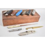 A Mod 20th century Wooden Box Containing Collection of Multitools, Pocket and Letter Opener Knives