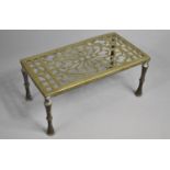 A Late 19th/Early 20th Century Pierced Brass Rectangular Trivet Stand on Turned Supports, 30cms Wide
