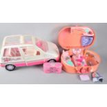 A Small Collection of Barbie Accessories and Vehicle