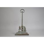 A Weighted Brass Door Porter in the Form of a Three Masted Tall Ship in Full Sail, 41cms High