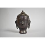 A Cast Bronzed Metal Bust of Buddha, 19cm high