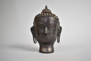 A Cast Bronzed Metal Bust of Buddha, 19cm high