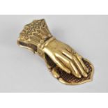 A 19th Century Brass Desktop Letter Clip in the form of a Ladies Hand, 13cm long