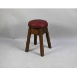 A Vintage Circular Four Legged Stool with Hide Upholstery, 34cm diameter and 51cm high