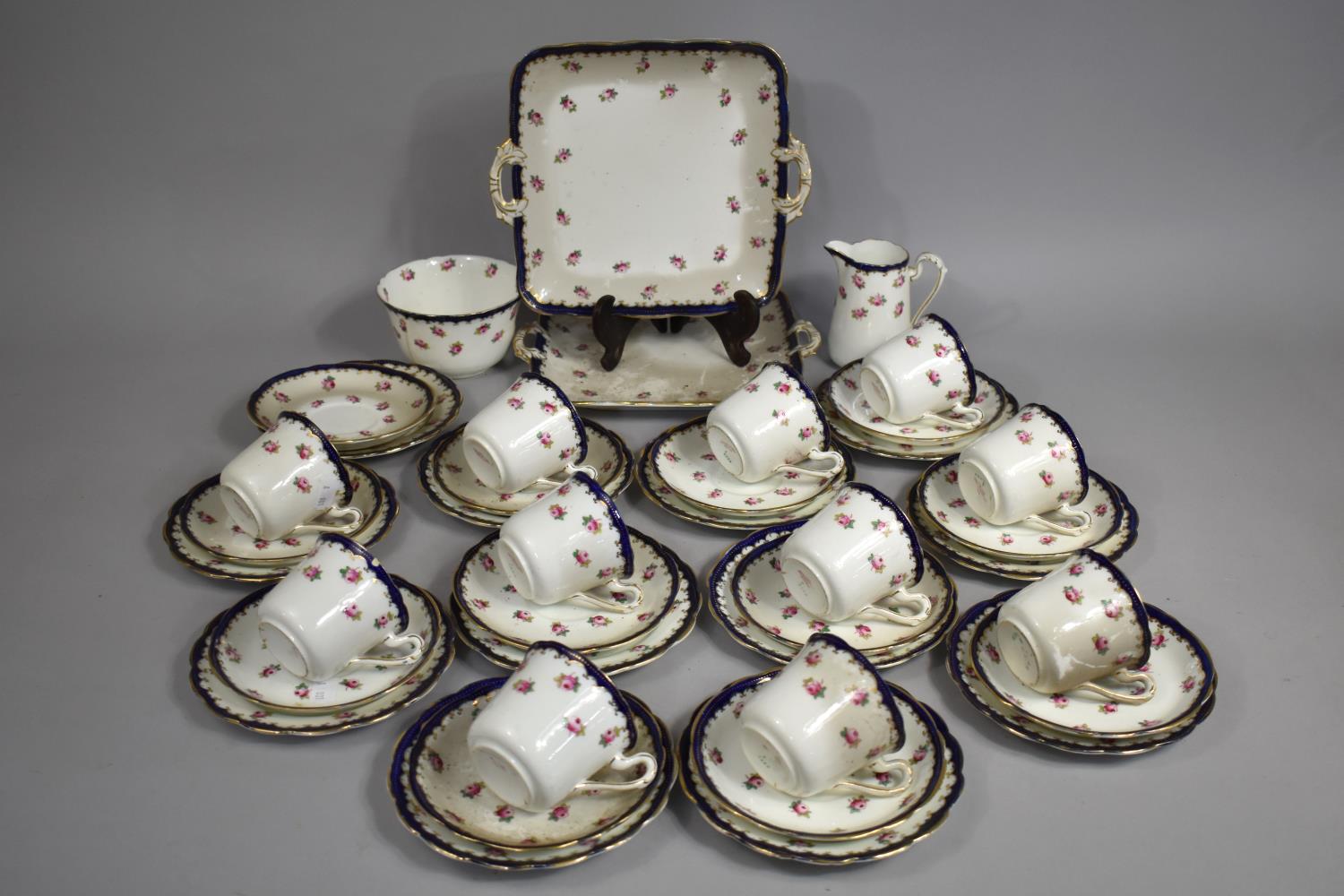 An Edwardian Grosvenor Rose Decorated China Tea Set to Comprise Eleven Cups, Twelve Saucers, Two