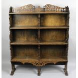 An Edwardian Carved and Pierced Oak Four Shelf Waterfall Bookcase with Galleried Top, 91cm wide