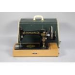 A Cased Singer Manual Sewing Machine