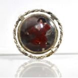 A Silver Mounted Brooch with Central Reverse Painted Miniature on Glass, 'The Red Boy' After Sir