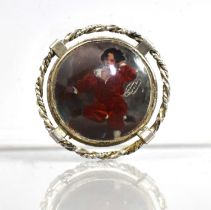 A Silver Mounted Brooch with Central Reverse Painted Miniature on Glass, 'The Red Boy' After Sir