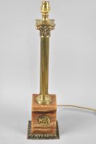 A Mid 20th Century Table Lamp Base in the Form of a Reeded Corinthian Column on Carved Onyx Support,