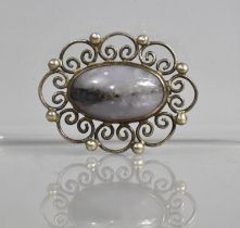 A Scottish Silver Brooch with Hardstone Cabouchon Surrounded by Scrolled Setting Mount, Edinburgh