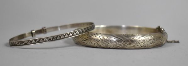 Two Silver Bangles, One Floral Decorated Having Safety Chain