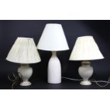 A Pair of Vase Shaped Table Lamps and a Taller Cream Glazed Example, all shades af