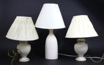 A Pair of Vase Shaped Table Lamps and a Taller Cream Glazed Example, all shades af